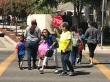 Lemoore Elementary Crossing Guard Alice Carlson says stands guard as local students end their first day off school.